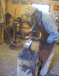 Tom blacksmithing